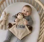 Baby with personalized baby comforter with name