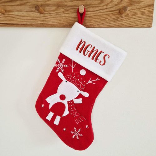 Red Christmas stocking with reindeer and name embroidered