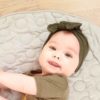 Green hair band on baby