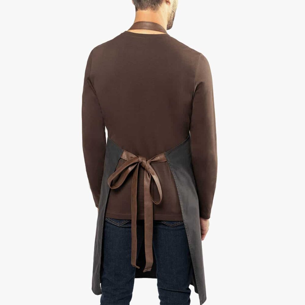 Back view of apron showing the adjustable neck strap and waist ties