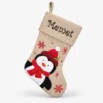 Brown woven Christmas stocking with penguin