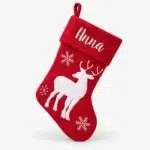 Red Christmas stocking with white reindeer