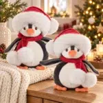 Baby Julius penguin soft toy from Bukowski in a festive Christmas setting